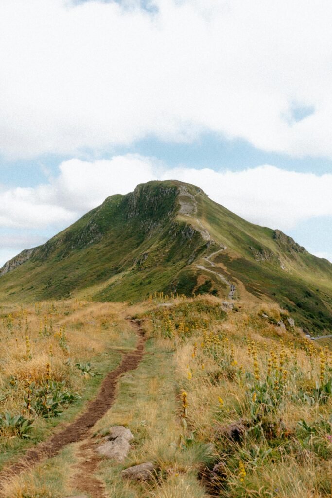 pexels-photo-34111849-34111849 A picturesque view of a mountain path leading through the lush Auvergne-Rhône-Alpes region in France.